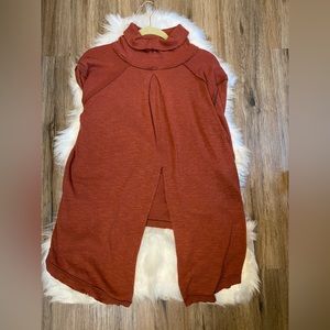 Free People too size US Large. Orange color, opening in the back.